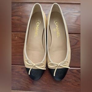 Nude cap toe Chanel ballet flats.